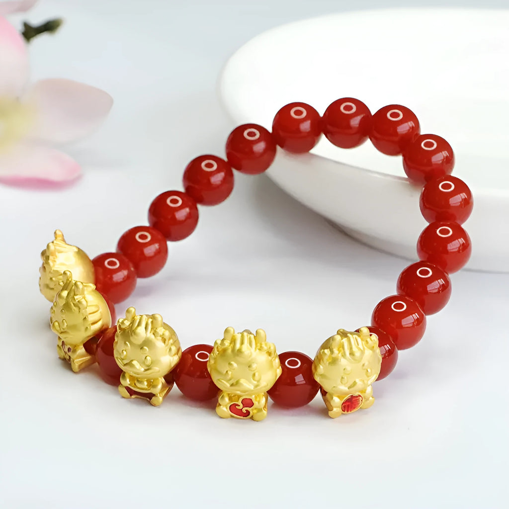Red agate bracelet with Chinese dragon motif on 8mm beads.
