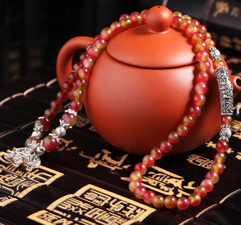 Handmade watermelon crystal bracelet with traditional Chinese knot design in geometric beads