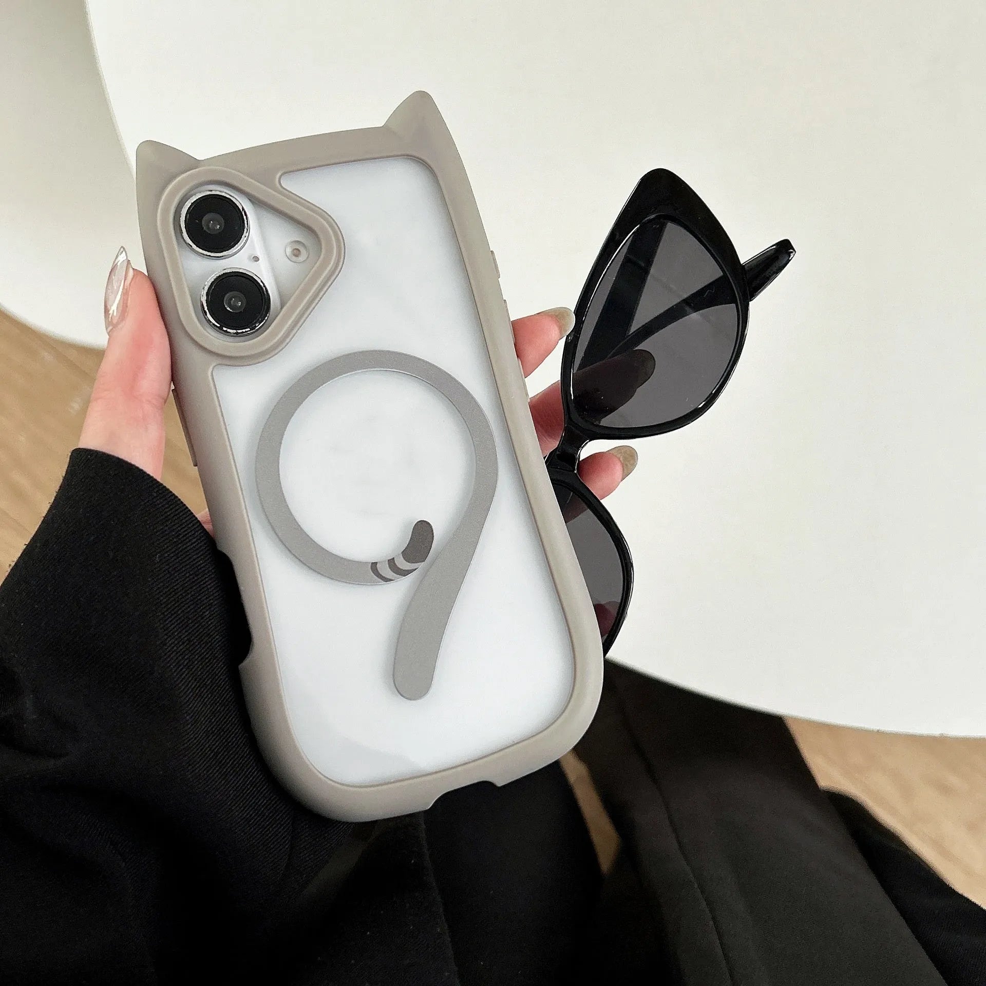 Transparent acrylic and TPU two-in-one phone case for iPhone 17 series in black, shown with magnetic function