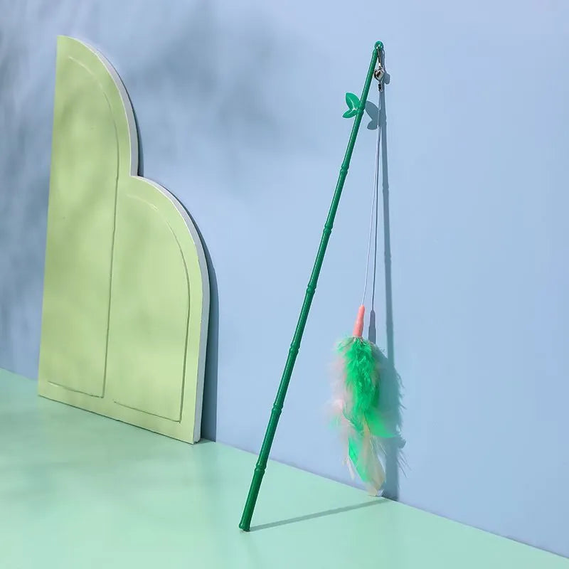 Green cat feather wand toy with bells and feather attachments for interactive feline play