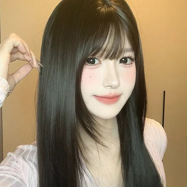 Dark brown long straight synthetic wig with fringe for round face shapes on wig head