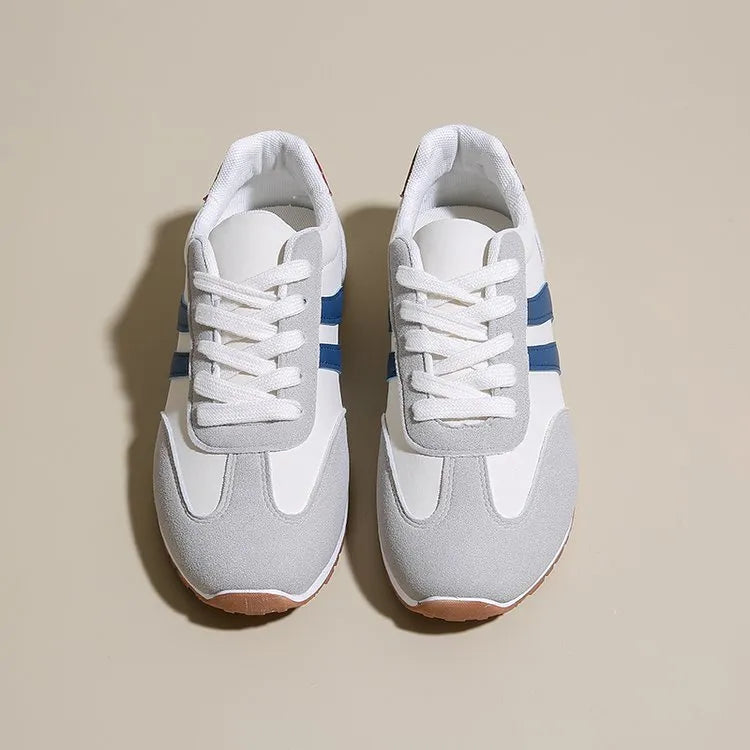 Blue and grey leisure sports shoes with Cortez stripes pattern, round toe, and flat rubber sole.
