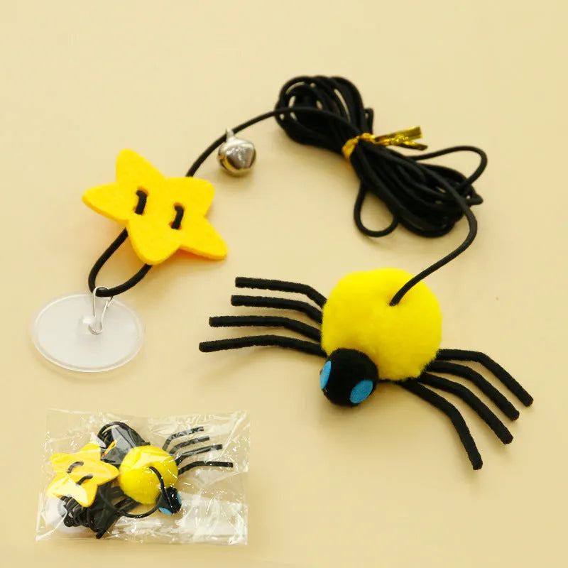 Red and yellow cat hanging door toy with elastic rope, feather, bell, and spider attachment