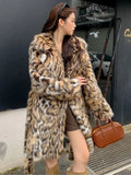 A street-fashion faux fur coat with a fox print pattern and a fur collar, shown in a long style.