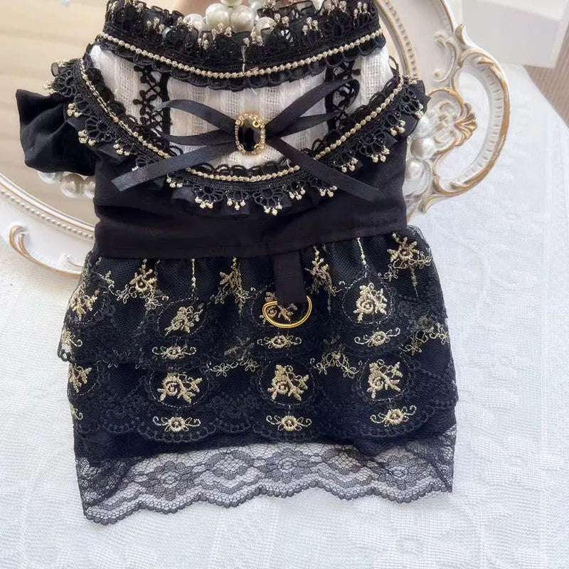 Golden gothic princess style skirt for a small dog on a mannequin, showing the size tag.