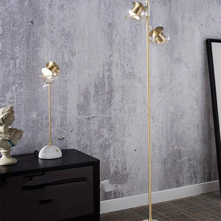 Clear glass desk lamp with touch dimmer and LED light on a wooden table