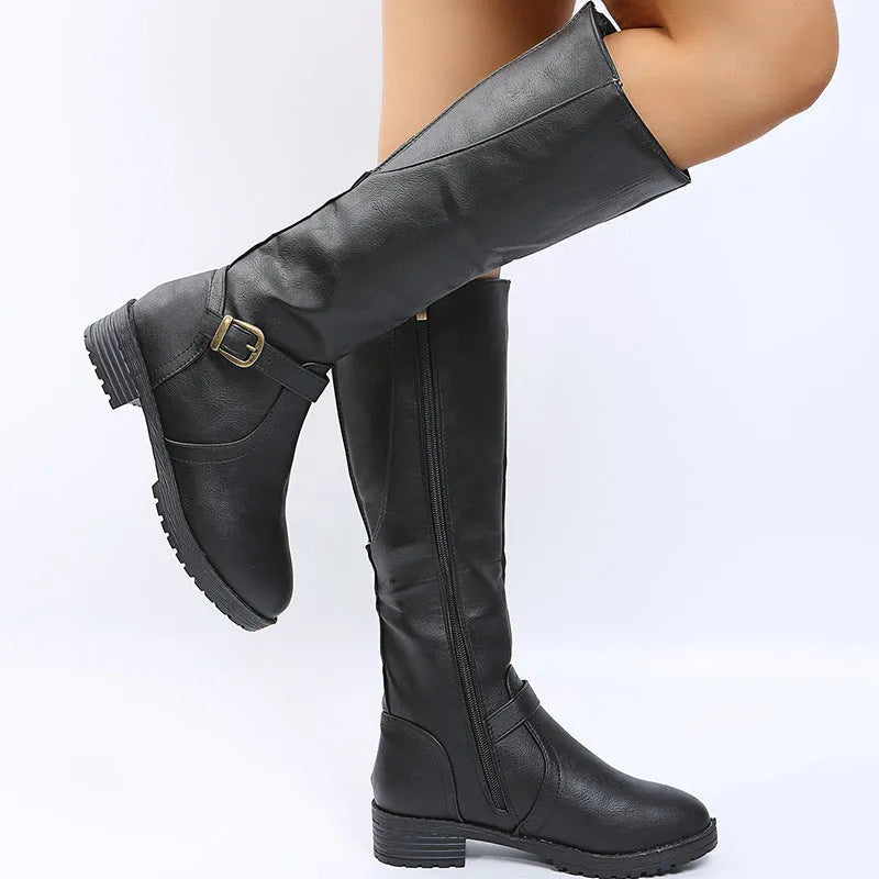 Women's black knight boots with square heel, round toe, and high shaft featuring belt buckle detail