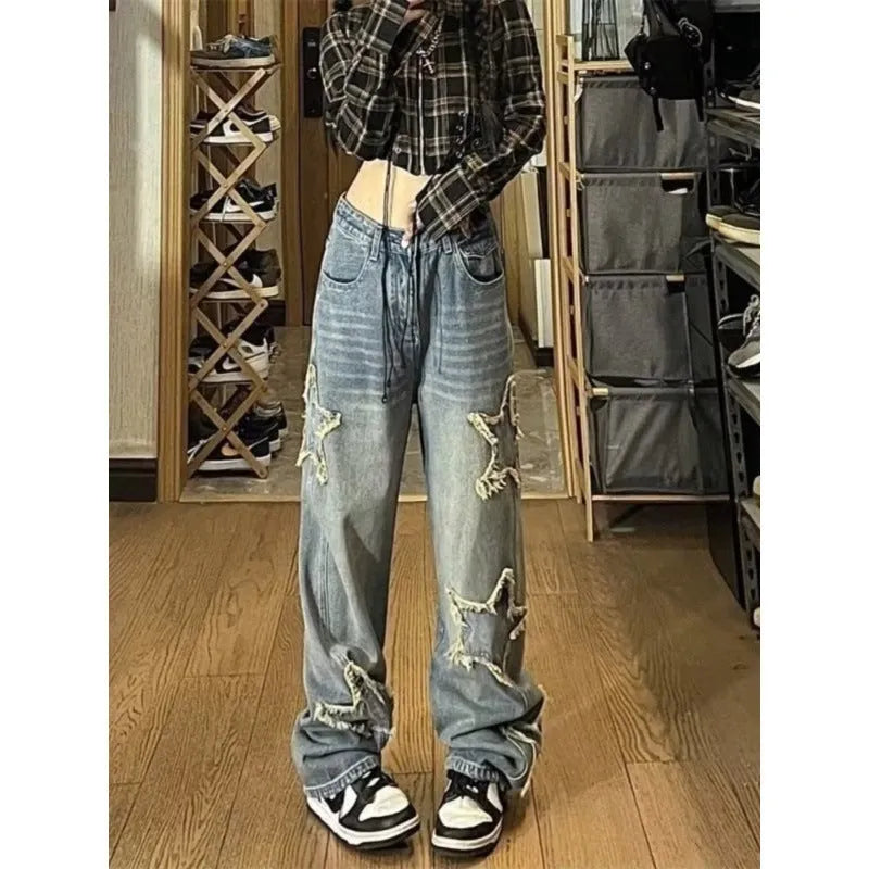 Blue high-waist women's wide-leg jeans made from cotton denim fabric on a neutral background.