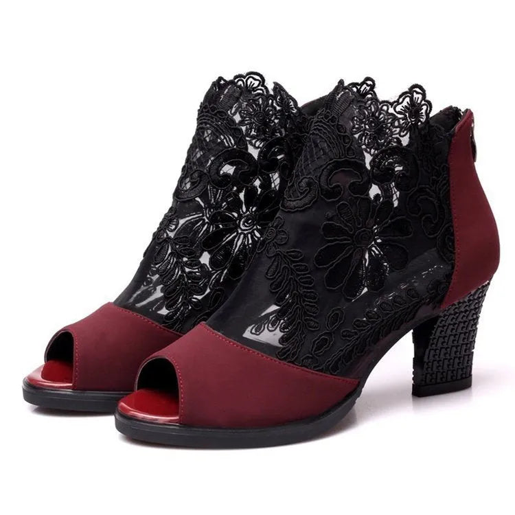 Black women's gladiator sandals with flower lace pattern and square heel on rubber outsole