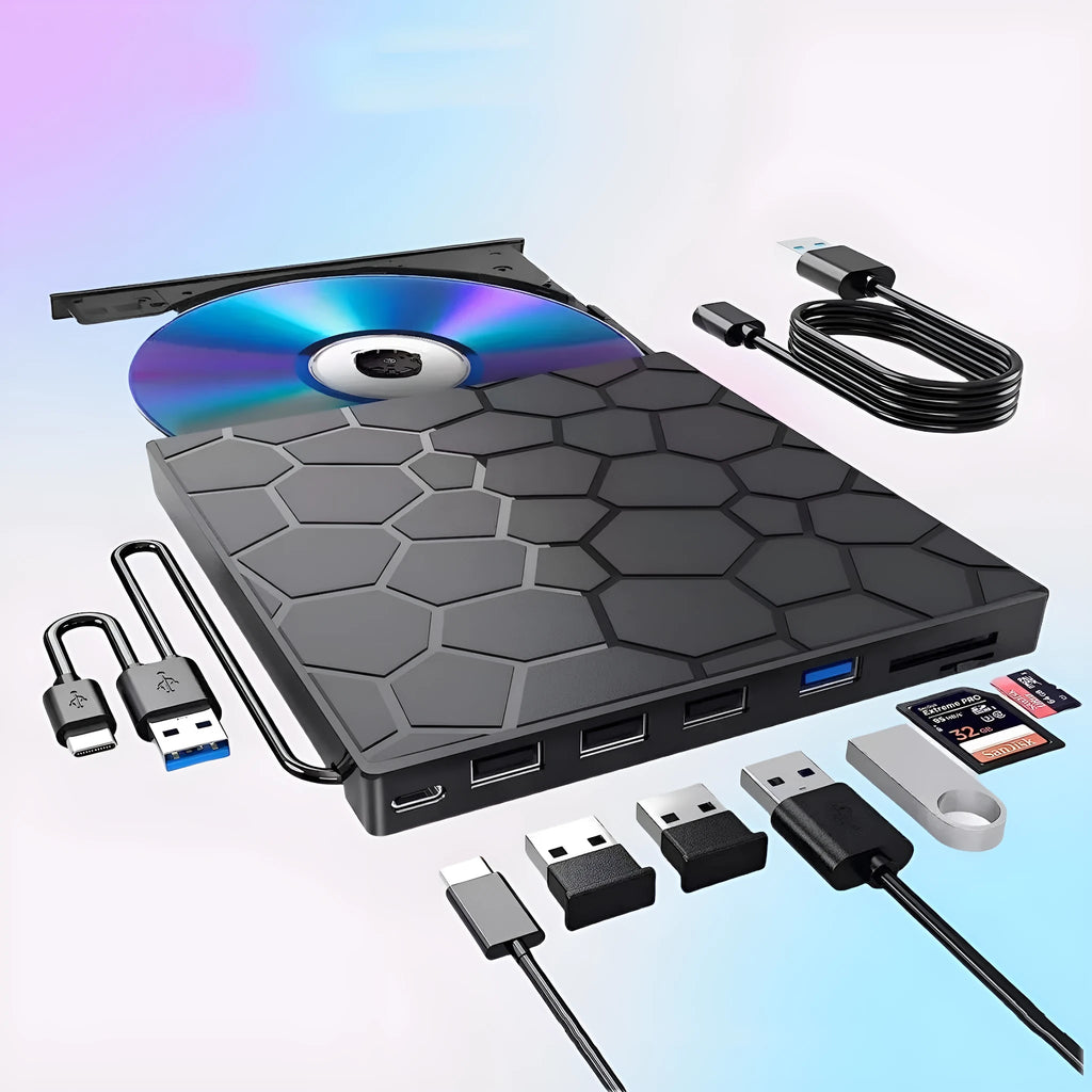 Black external USB CD drive and writer on a desk next to a laptop.
