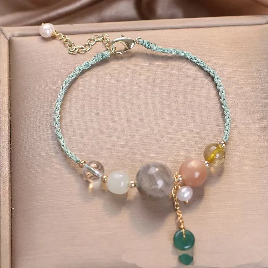 Hand-woven crystal sequin bracelet with peace buckle closure in blue, green and red colour options