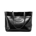 Casual leather crossbody handbag in wax cowhide with two compartments and phone pocket