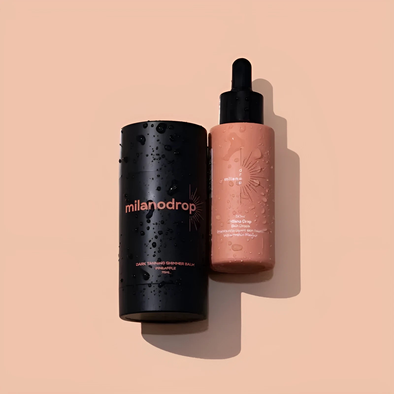 Matte black sun tanning liquid drops bottle and tanning flash cream tube set for a gradual tan.
