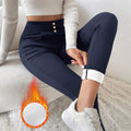 Navy blue women's high waist slim trousers with straight leg cut on hanger