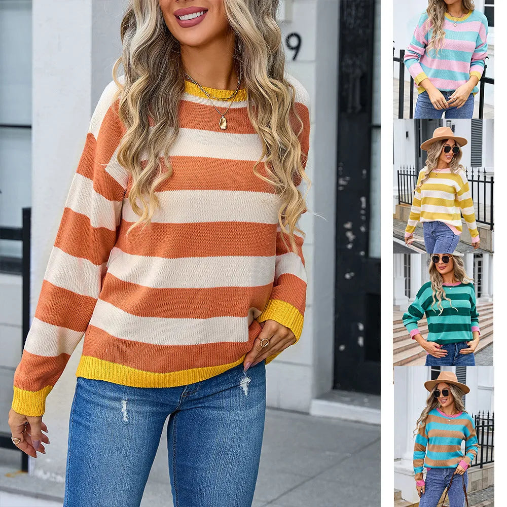 Women's loose fit long sleeve acrylic sweater in blue, showing round neck and stripe detail.