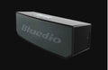 Black BS-6 cloud smart speaker with 52mm driver, compact rectangular design for desk or shelf placement
