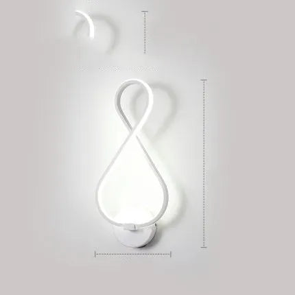 LED wall lamp with silicone shade in black or white finish showing button switch control