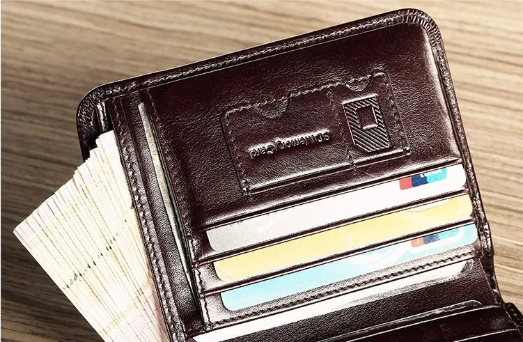 Men's leather organiser wallet open to show internal compartments including card slots and a zipped coin pocket.