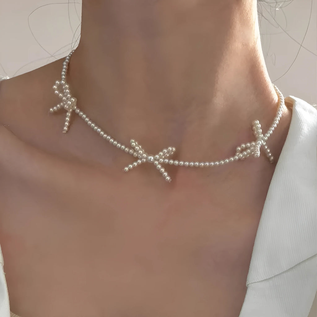 White geometric bow pearl necklace for women with adjustable 31-40cm length