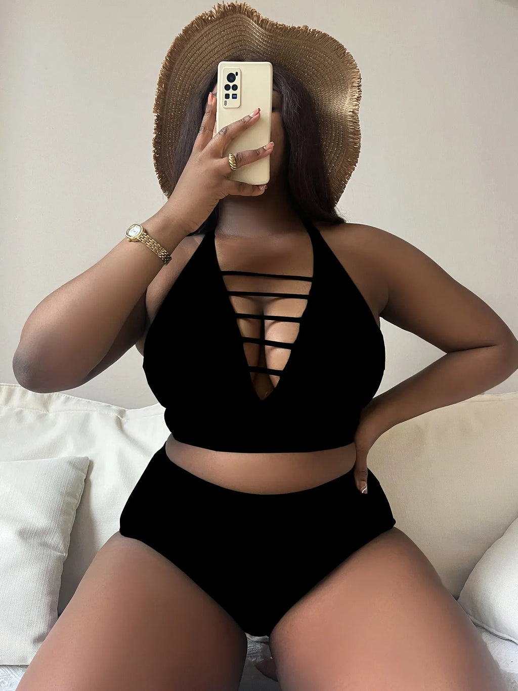 Plus size woman modelling a solid colour halter bikini with adjustable cross straps and high waist briefs.