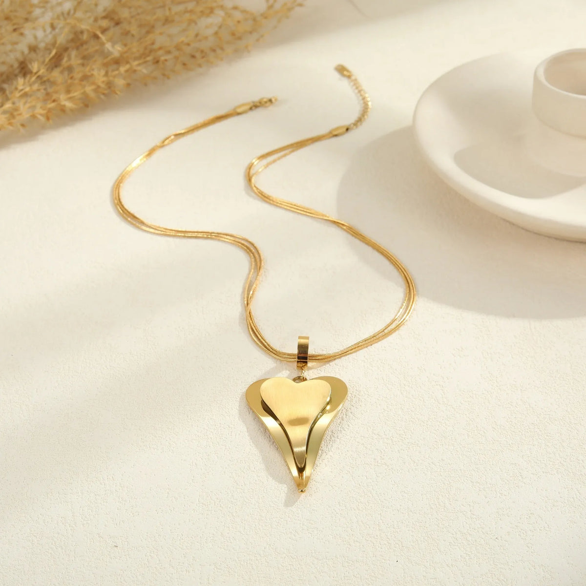 Double heart snake bones geometric pendant necklace in gold or steel finish on regular chain