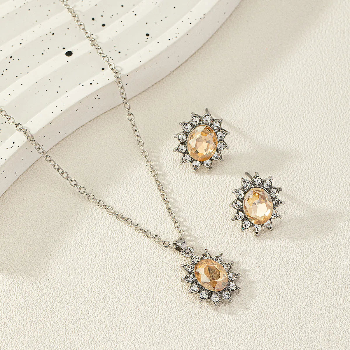 Alloy necklace and earring set with elliptical zircon elements in electroplated colours