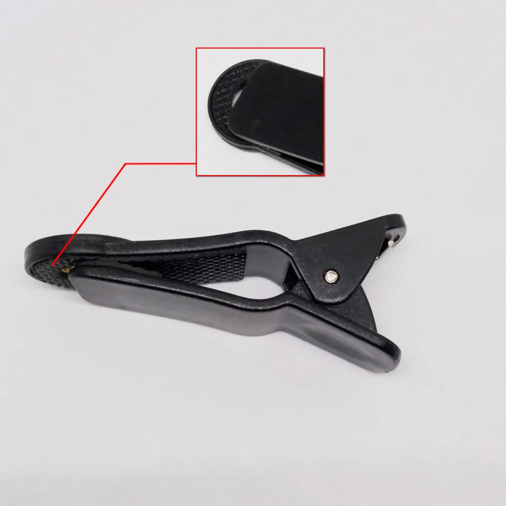 Universal 12x telescopic zoom lens with collar clip for smartphones on a white background.