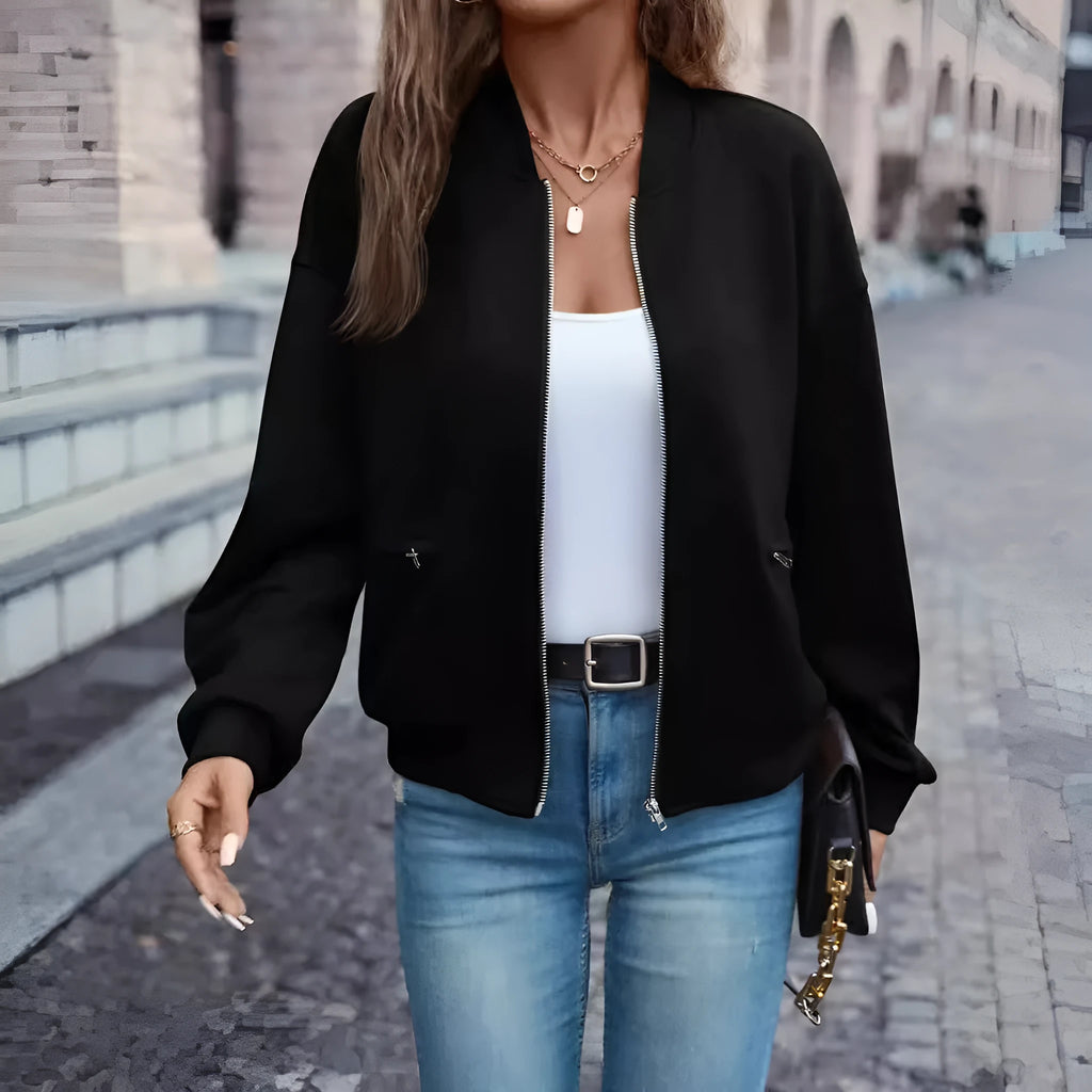 Black women's zip-front casual jacket with long sleeves and faux pocket detailing