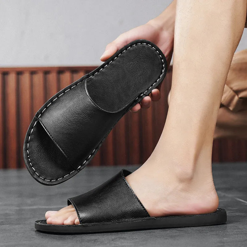 Men's brown leather sandals with rubber soles showing open-toe design