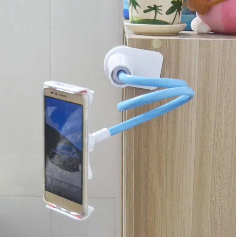 Black oversize bedside phone holder with a long flexible arm mounted on a wooden table.