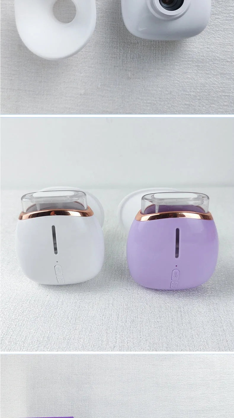White portable eye humidifier with USB charging cable on a table