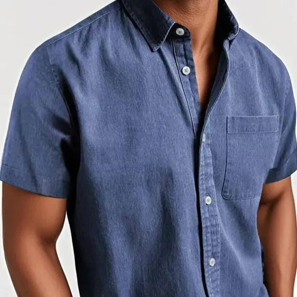 Man wearing a loose-fit grey short-sleeve cotton blend shirt with a single-breasted cardigan style.