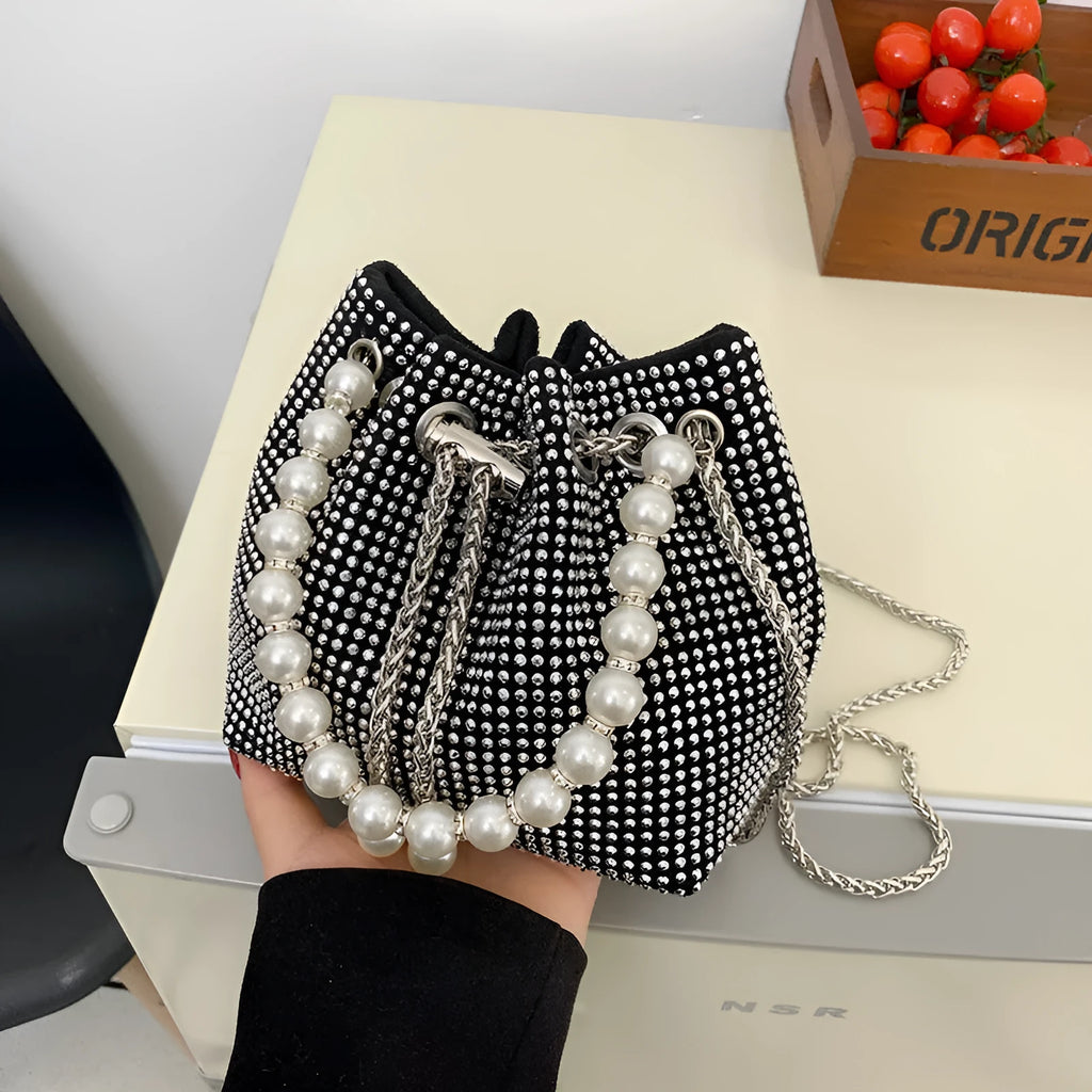 Women's fashion crossbody bag with diamond detailing and chain strap in soft PU material.