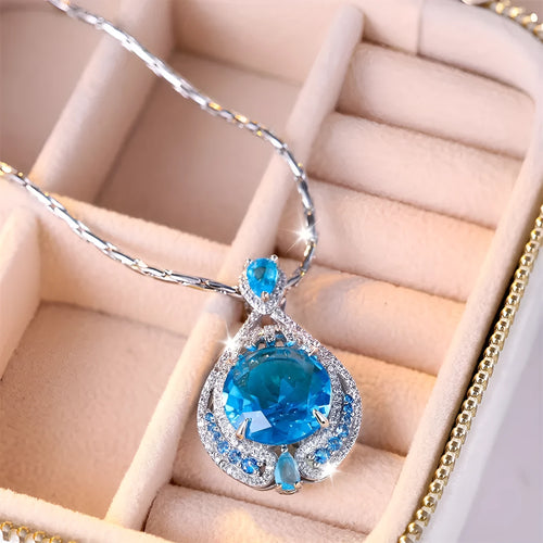 Blue geometric pendant necklace with fireworks cut crystal on a water wave alloy chain for women