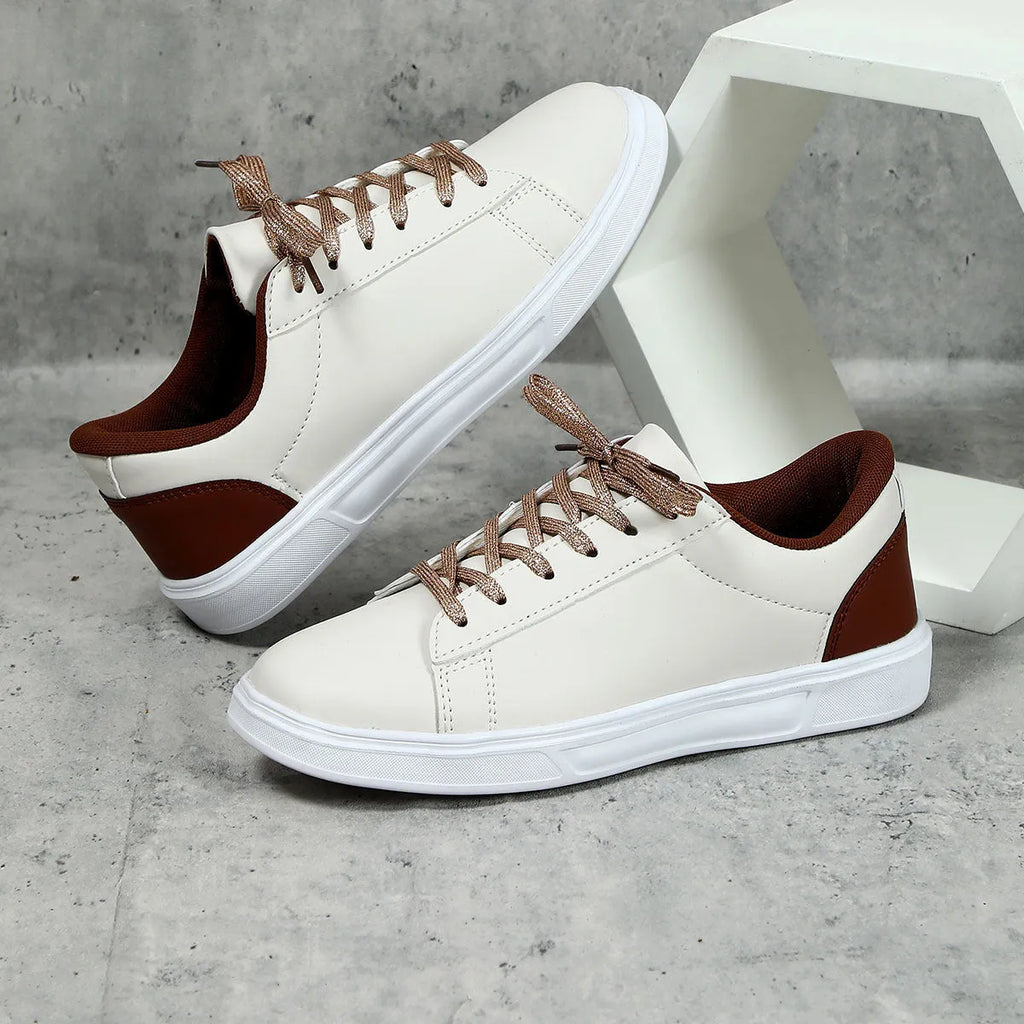 Women's platform skateboard sneakers with cross-strap detailing and mid-heel sole