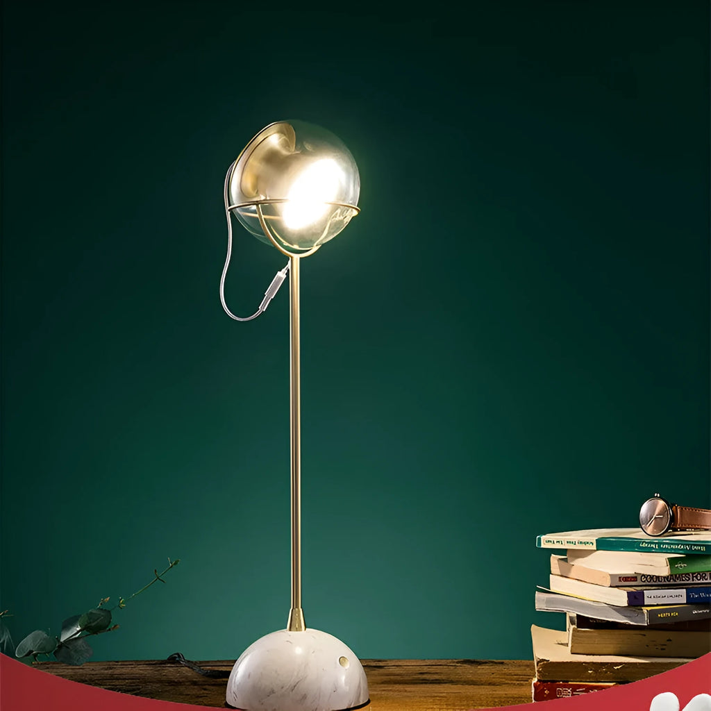 Clear glass desk lamp with touch dimmer and LED light on a wooden table