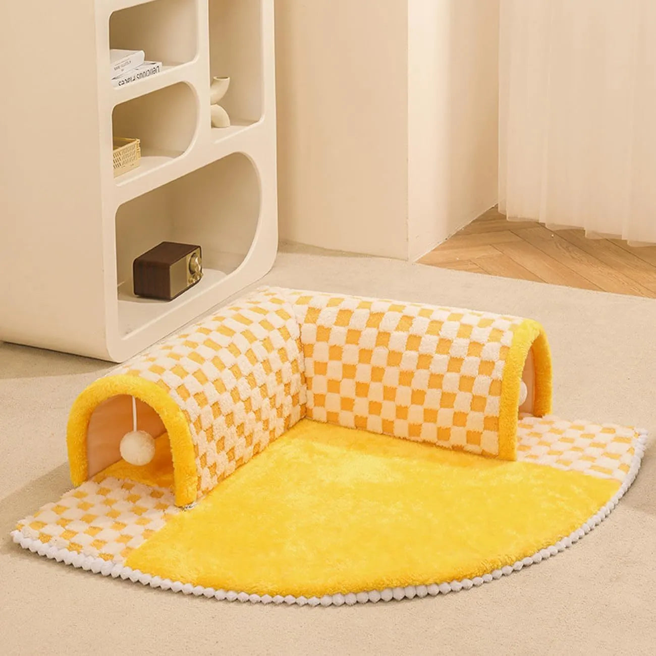 A coffee-coloured plush fan-shaped pet bed with an attached tunnel for cats and dogs.