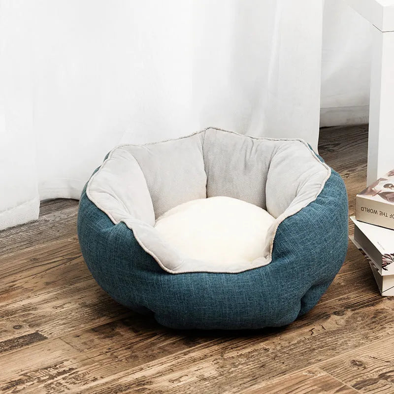 Octagonal grey pet bed with soft padded rim and removable inner mat for a small dog