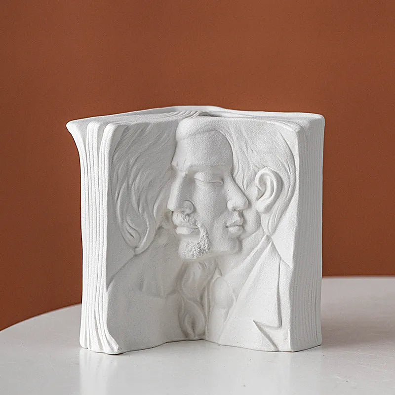 Ceramic book stand with glazed surface in a modern design, displayed on a desktop.