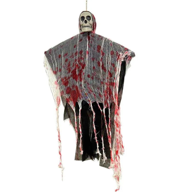 Halloween decoration showing a luminous blood-dyed plastic skull with a hanging ghost outdoor ornament