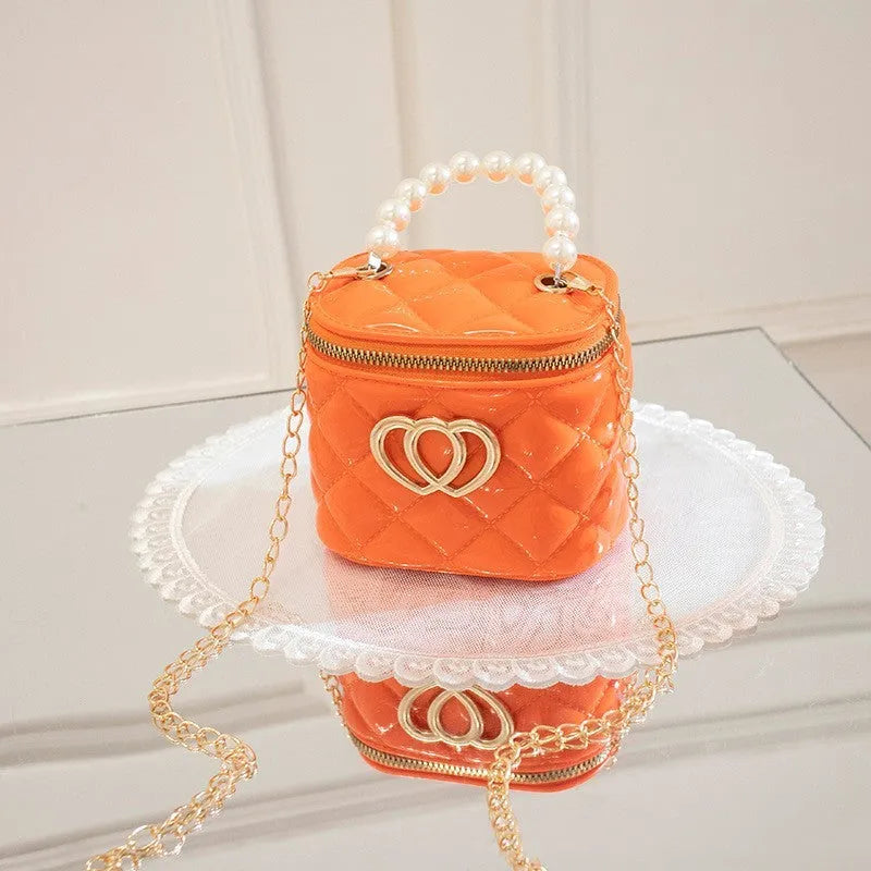 PVC bucket gel handbag with heart pattern in multiple colour options including apricot, black, green, orange, red, white and yellow
