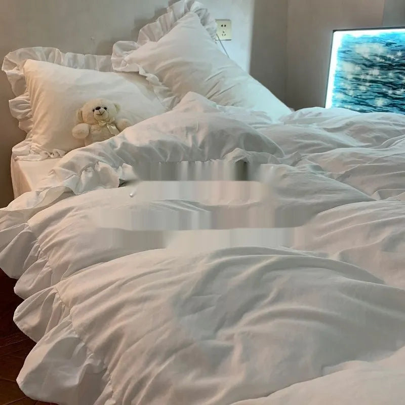 Washed cotton linen four-piece bedding set in a solid pastel colour, showing quilt cover and pillowcases.