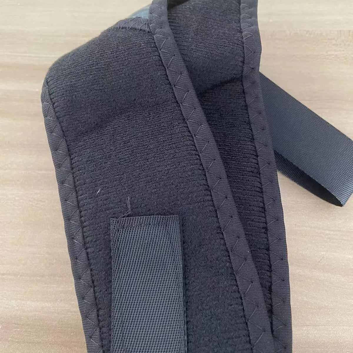 Babaka adjustable nylon posture correction band worn for upper back support.