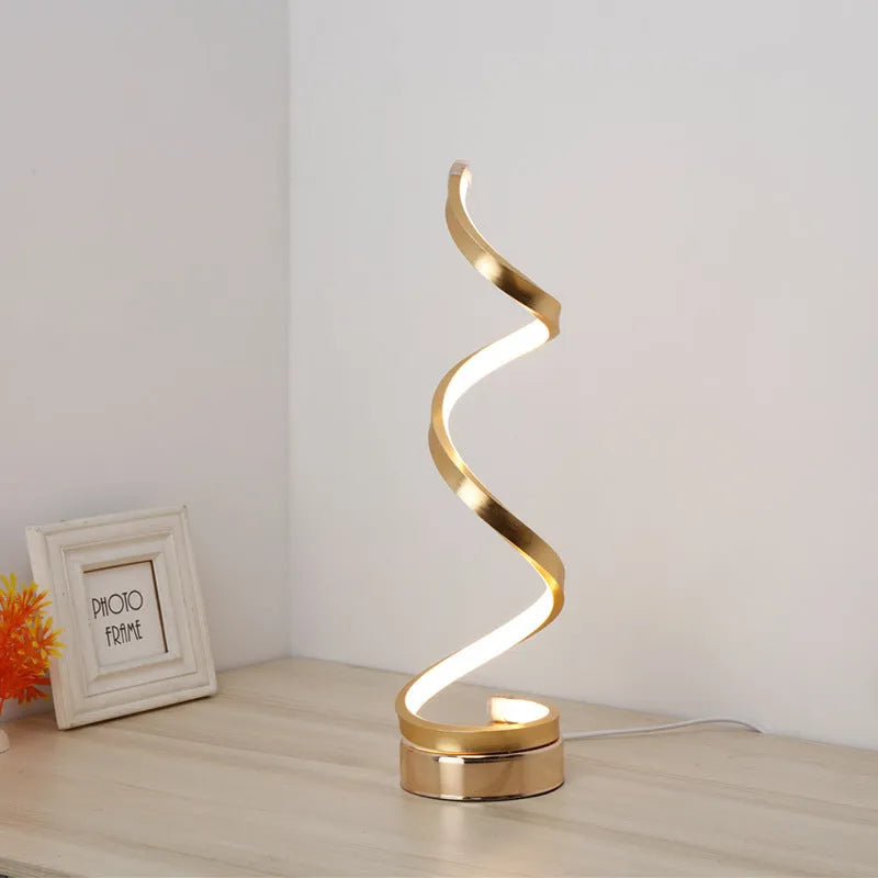 Minimalist black or white LED desk lamp with aluminium shade on a metal base.