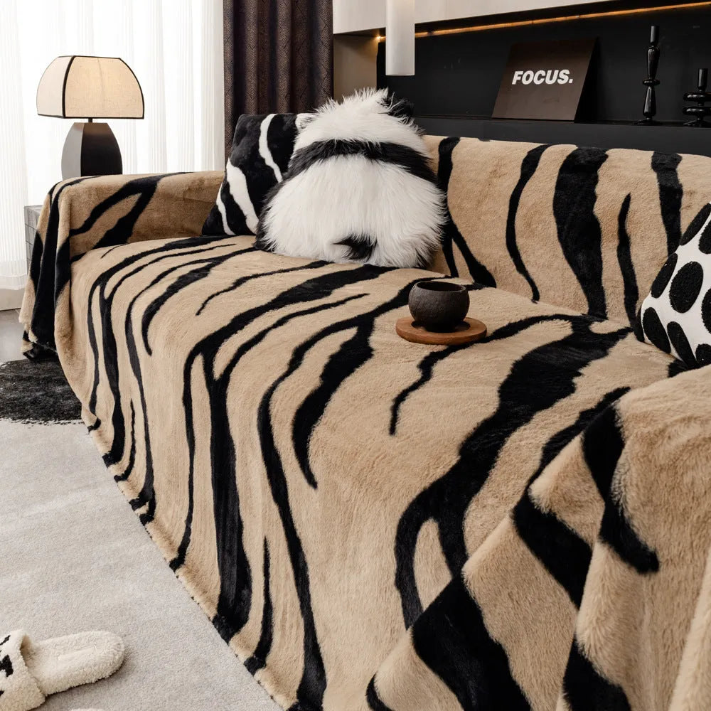 Zebra pattern flannel sofa cover and pillowcase set on a sofa, shown in caramel colour.