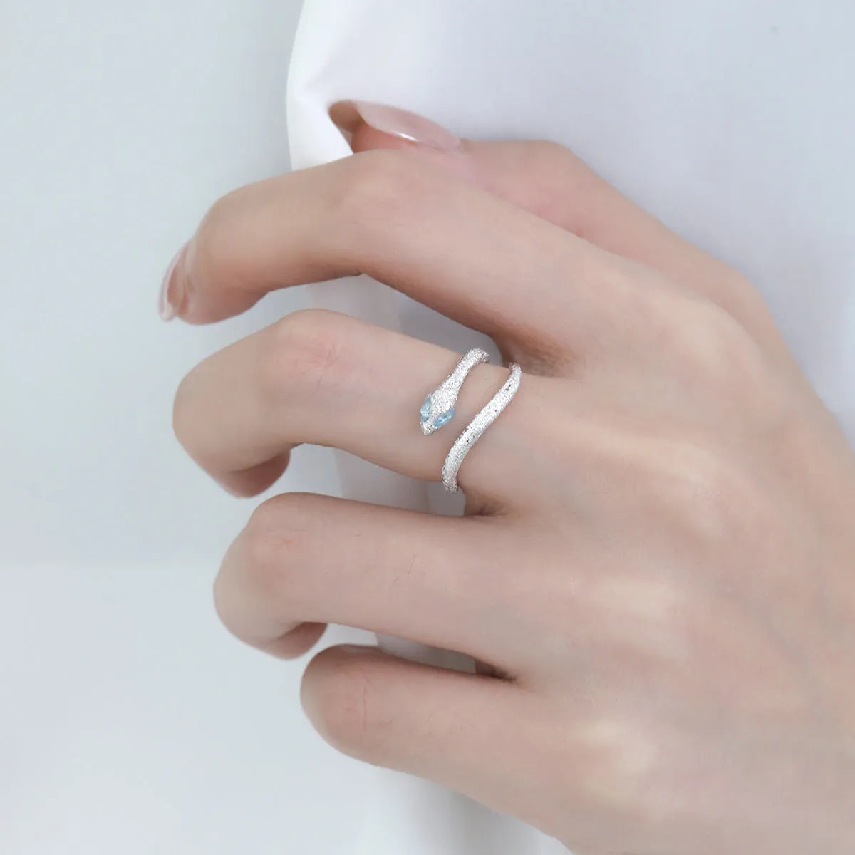 Adjustable silver snake ring with electroplated platinum finish and white gold colour