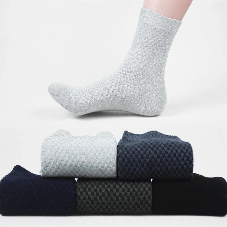 Men's black bamboo fibre socks with small square pattern on ankle