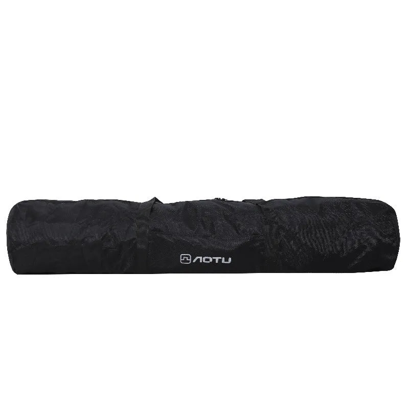 Large black waterproof storage bag with carrying handles, shown next to a folded camping chair.