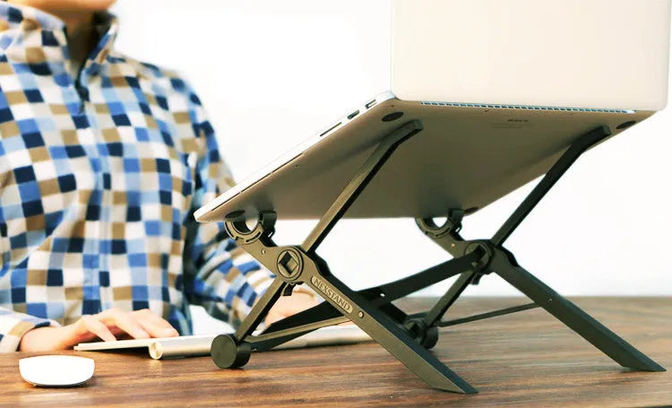 Black folding laptop stand with reinforced nylon construction showing compact folded position