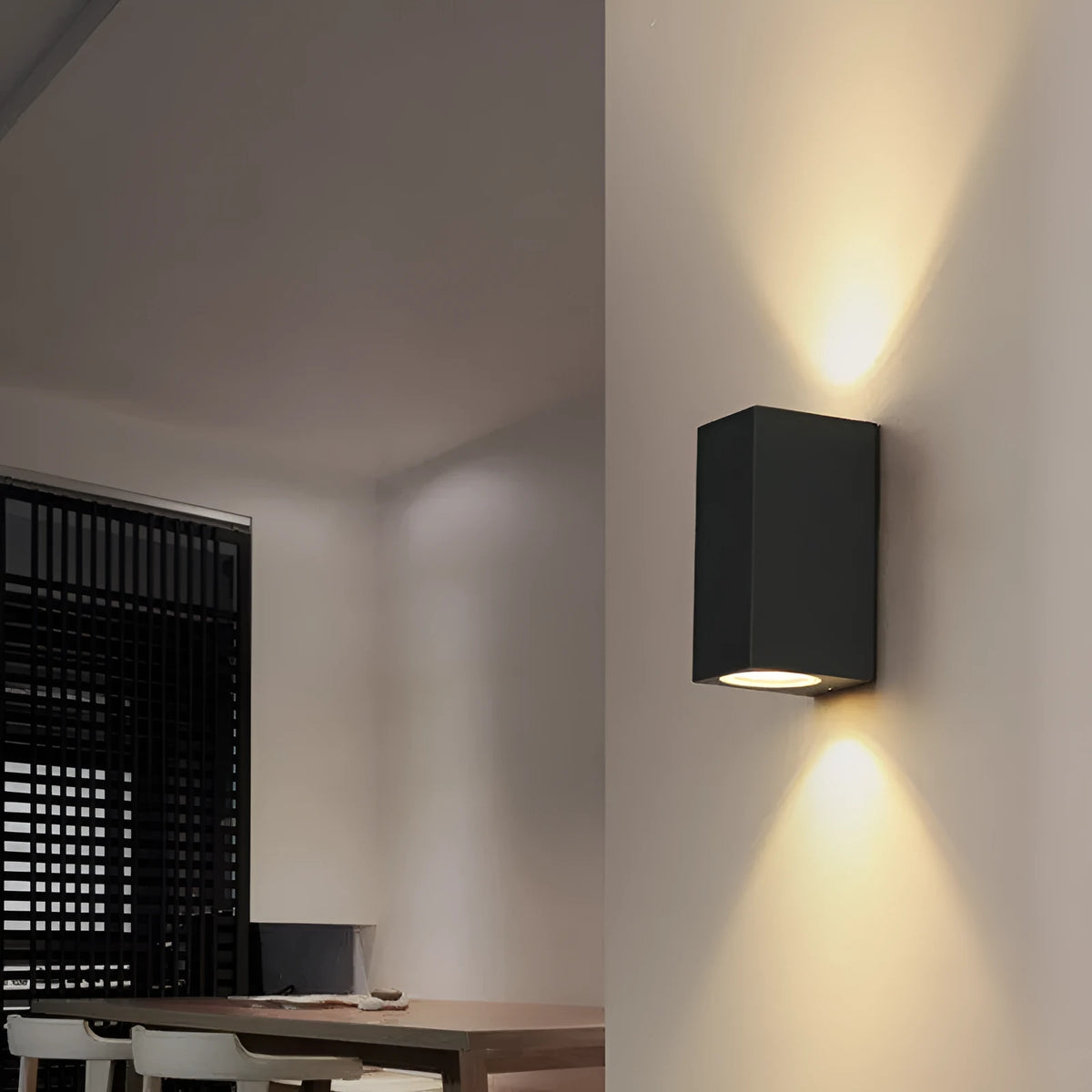 Black aluminium wall lamp with silicone rubber trim and glass elements
